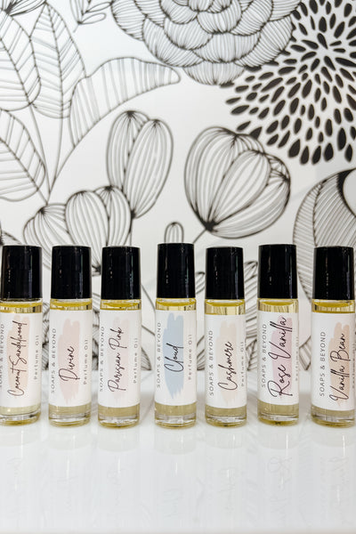 Glass perfume roller bottles made in the USA, infused with Kukui nut oil and natural fragrance blend, paraben-free and skin-friendly.