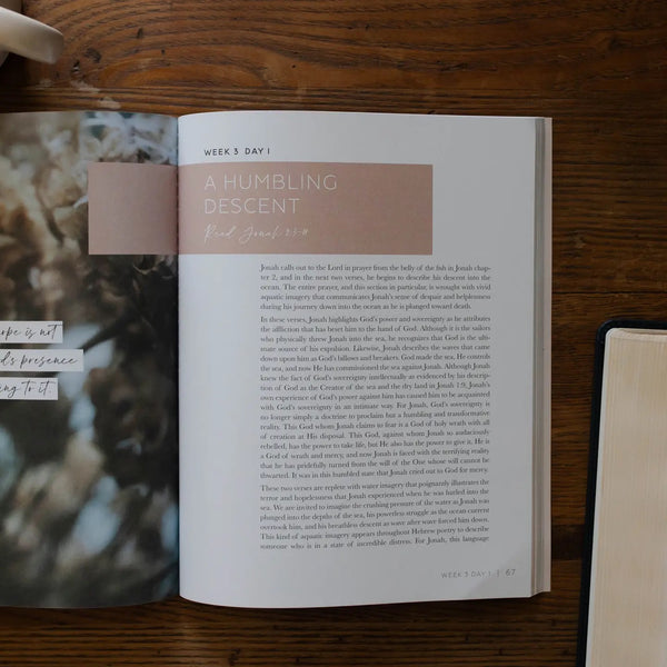 Mercy in the Storm Bible study on the Book of Jonah with soft cover and modern design opened to week 3 day 1 titled a humbling descent