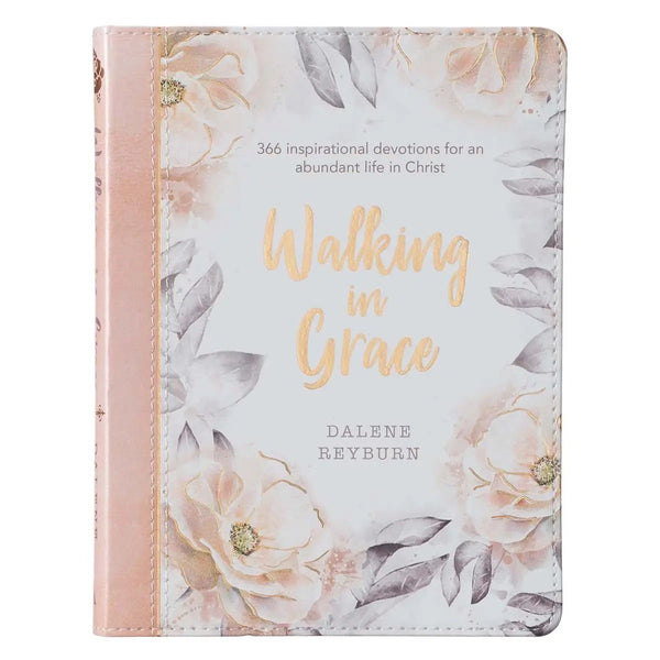 A faux leather devotional book titled 'Walking in Grace' by Daleene Reyburn, featuring a floral design with pink and peach flowers on the cover.
