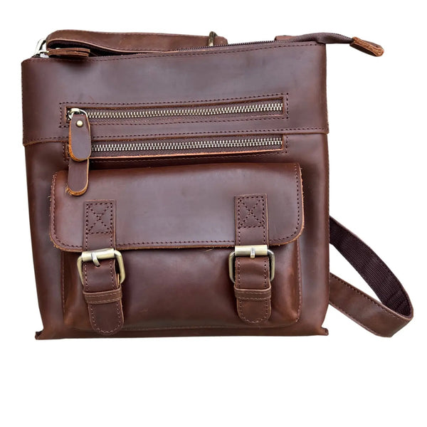 Brown leather crossbody shoulder bag with front zipper pockets, magnetic snap front pocket, back zipper pocket, and adjustable strap