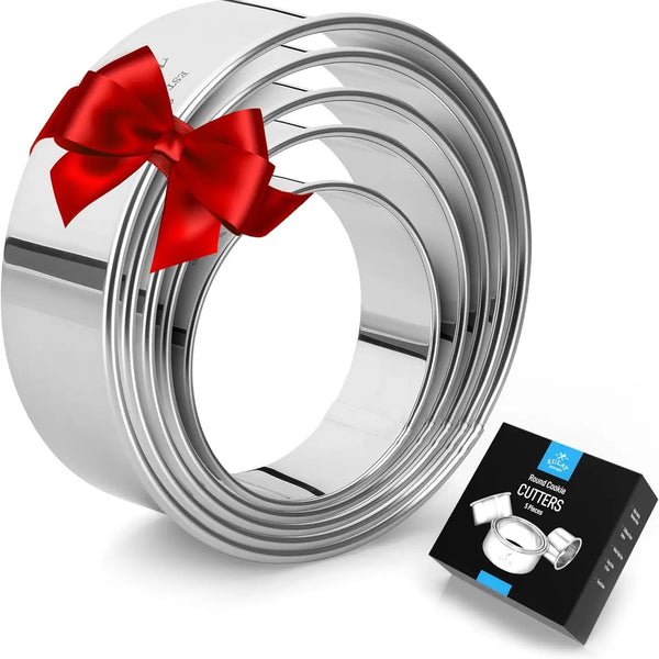 A set of stainless steel cookie cutters with a round shape and a red ribbon design on one of the cutters, presented next to its packaging.